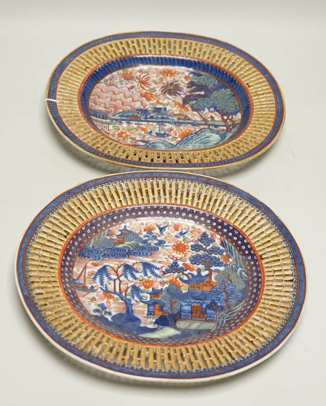 A pair of late 18th century Chinese chestnut basket stands with Dutch over enamelled decoration, 27.5cm